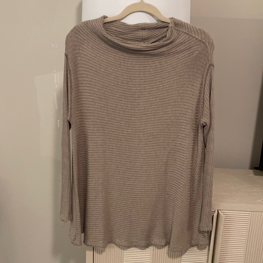 Free people ribbed, tan cow necked sweater. Has 2 small openings on back. Small!